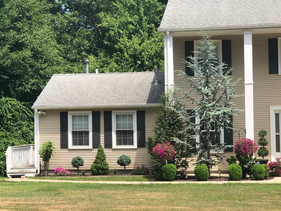 Private, side-entrance. Only 2 steps up, then a walkway, then 1 last step. 2-bedroom windows.