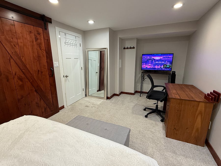 TV, desk and workstation.