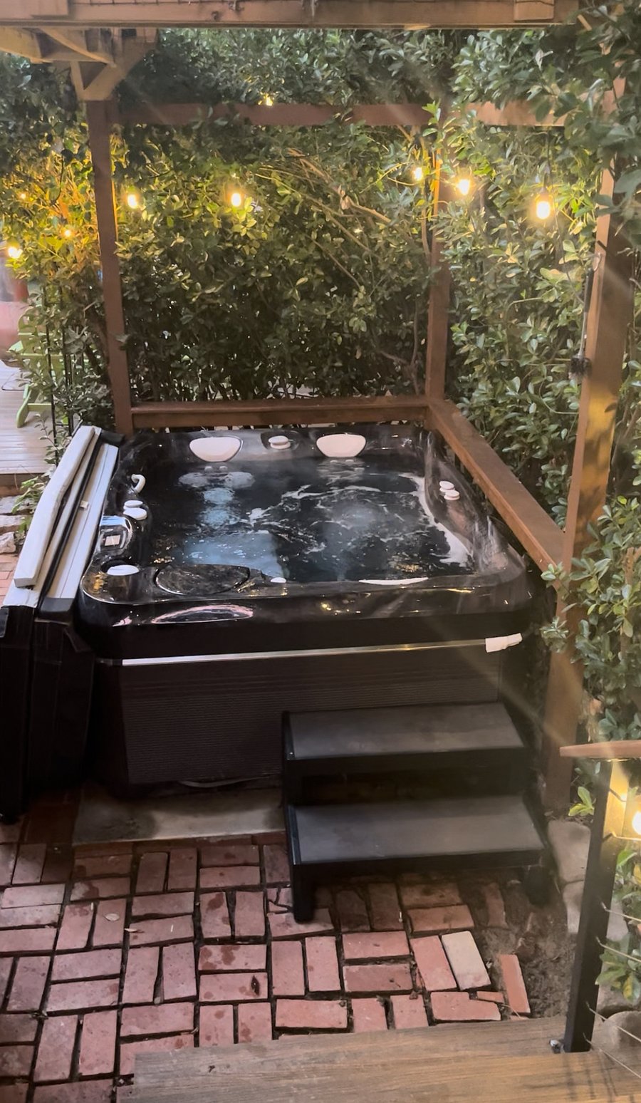 Hot tub in a private corner of the backyard
