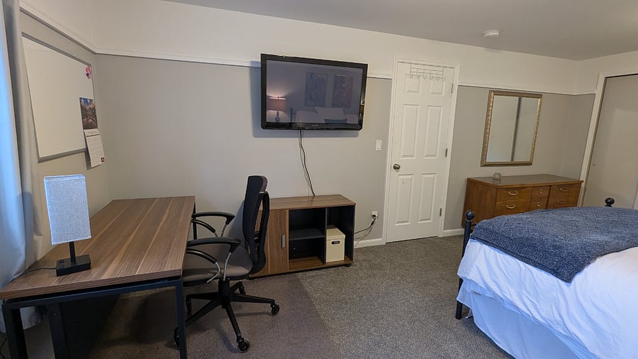 Large desk and office chair to accommodate working from home.