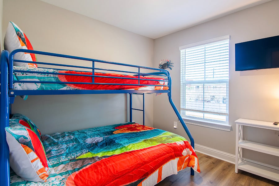 Third bedroom with full size bunk and twin bunk