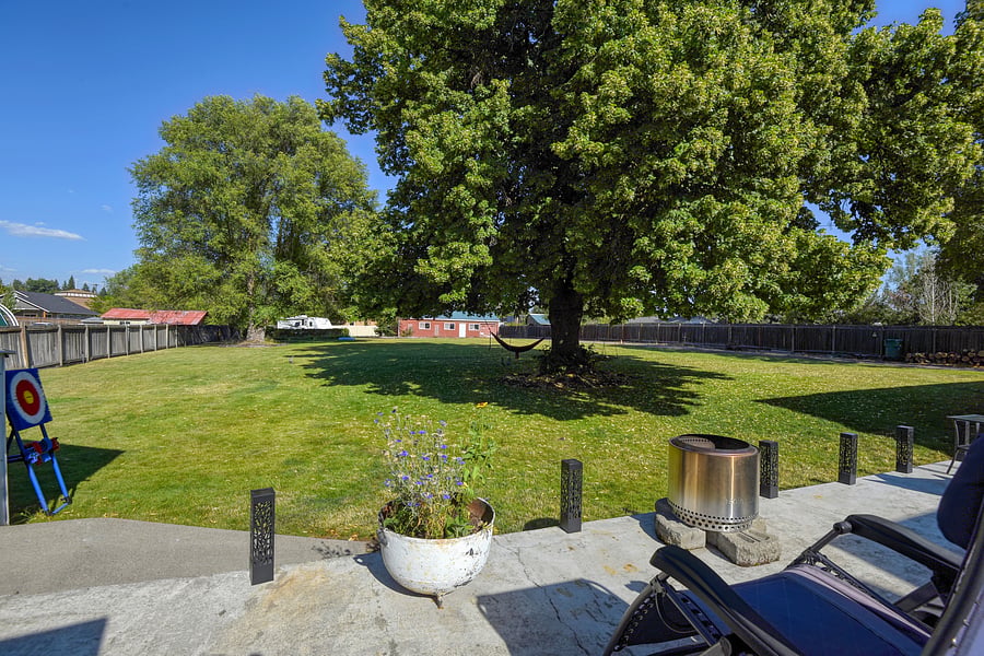 Private, fenced & shady back yard offers comfort and inspiration morning, noon and night.