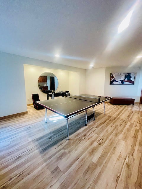 Large chill space with ping pong table, fuse ball, and gaming.