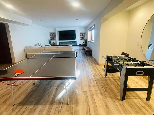 Large chill space with ping pong table, fuse ball, and gaming.