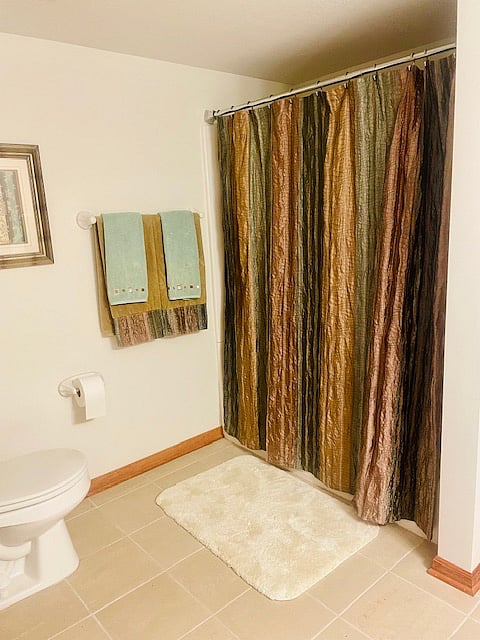 Full Private Bath with Tub, Shower, and Large Vanity.