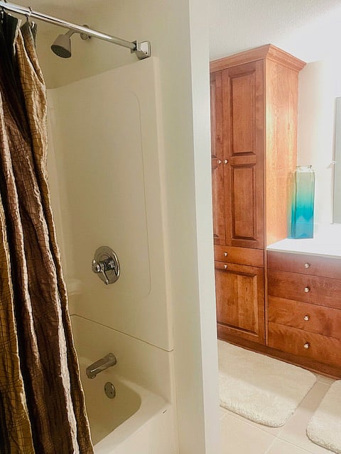 Full Private Bath with Tub, Shower, and Large Vanity.