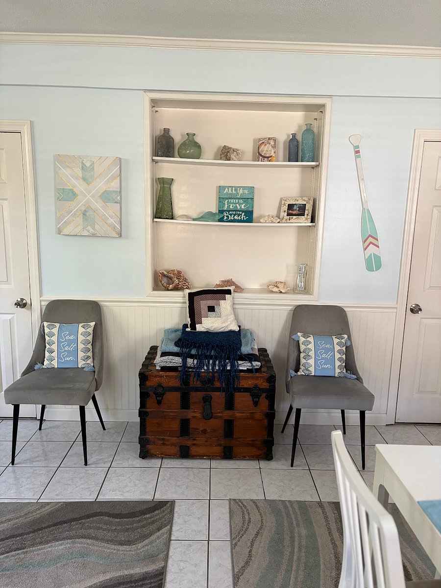 Living area book shelf and two extra chairs