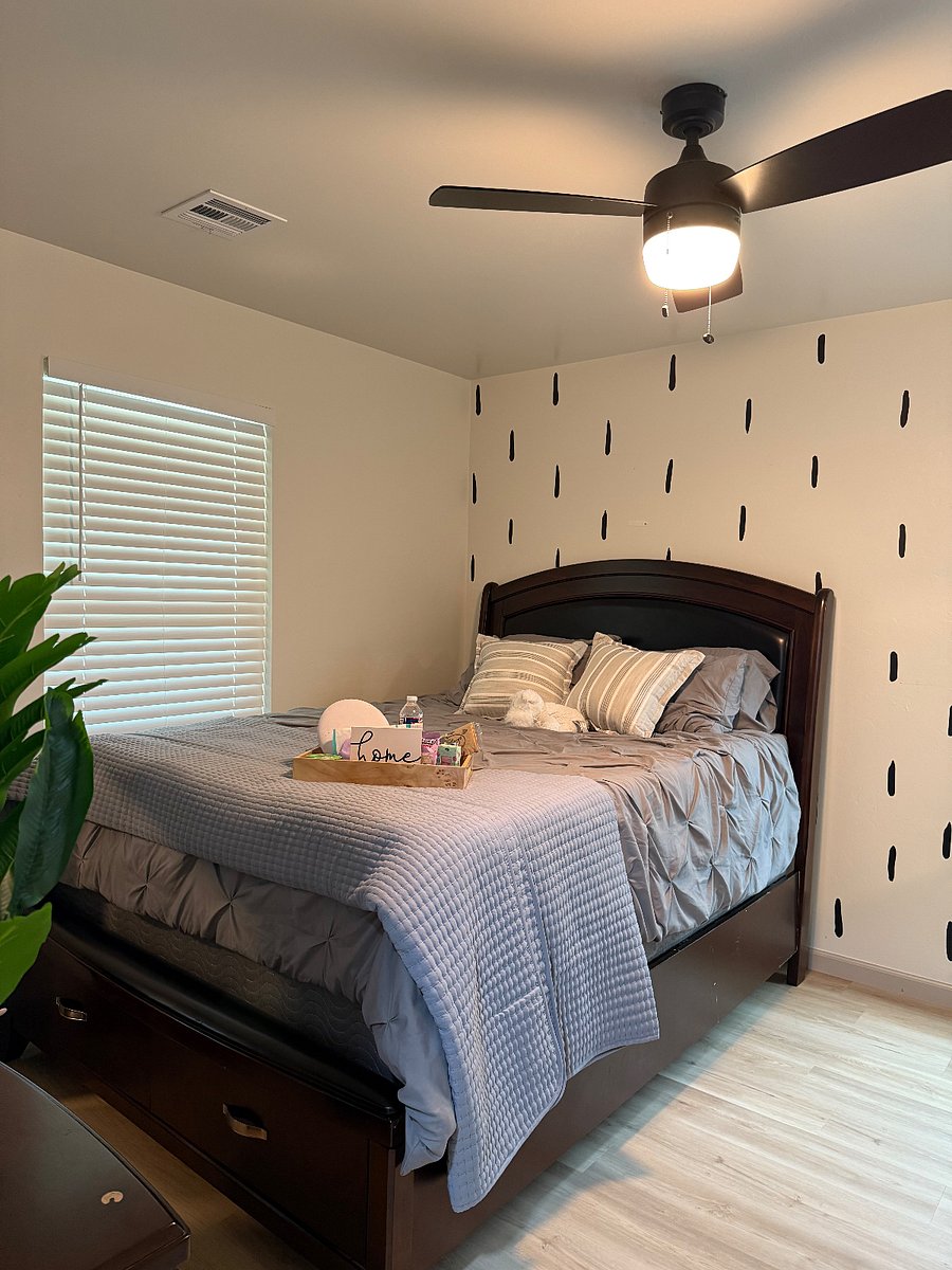 Queen size bed, with dresser, chest and night stand, lamp.