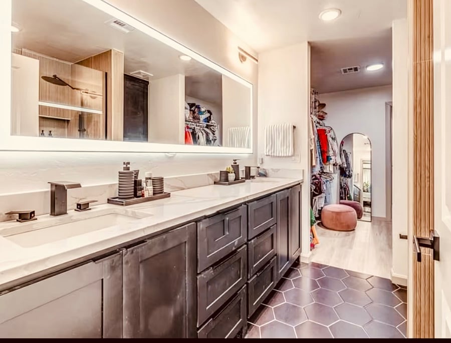 Touch screen mirror, toilets have bidets, two faucets, large closet 