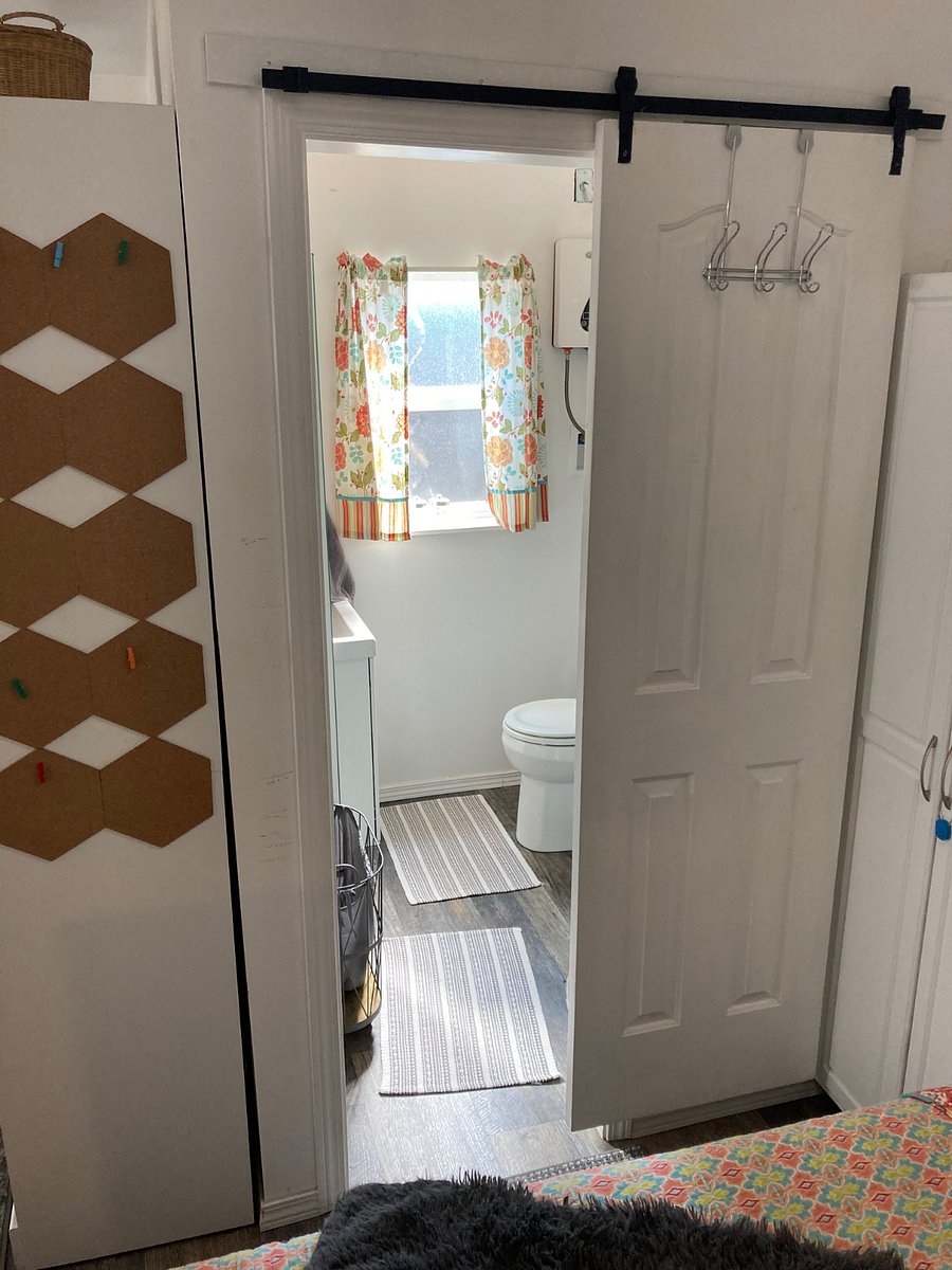 Really cute little bathroom with tons and tons of storage and a beautiful tiled shower. On demand hot water means you never run out of hot water in your shower.