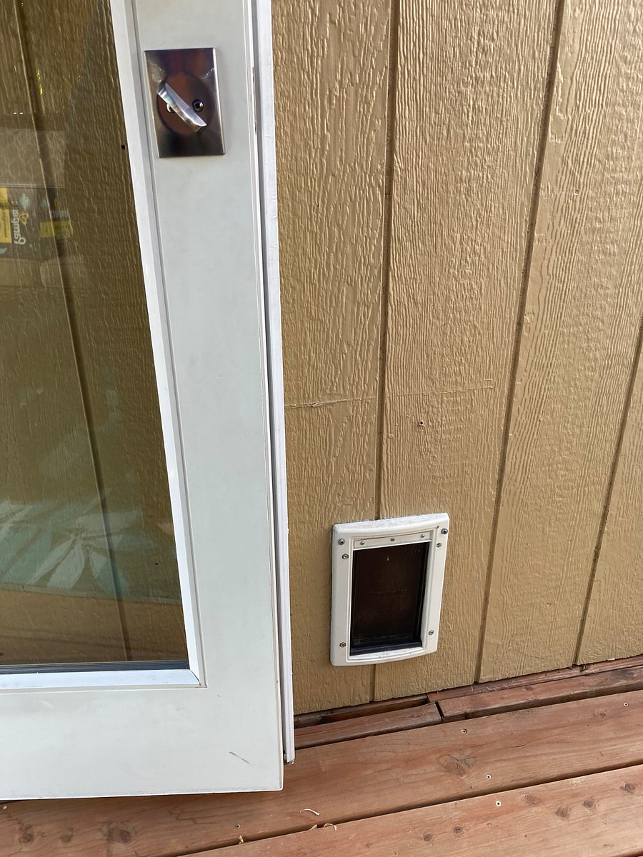 Doggy Door for a very small dog. There is a fence surrounding the cottage and also a fence surrounding the whole backyard so if your dog needs more place to run. He or she has it.