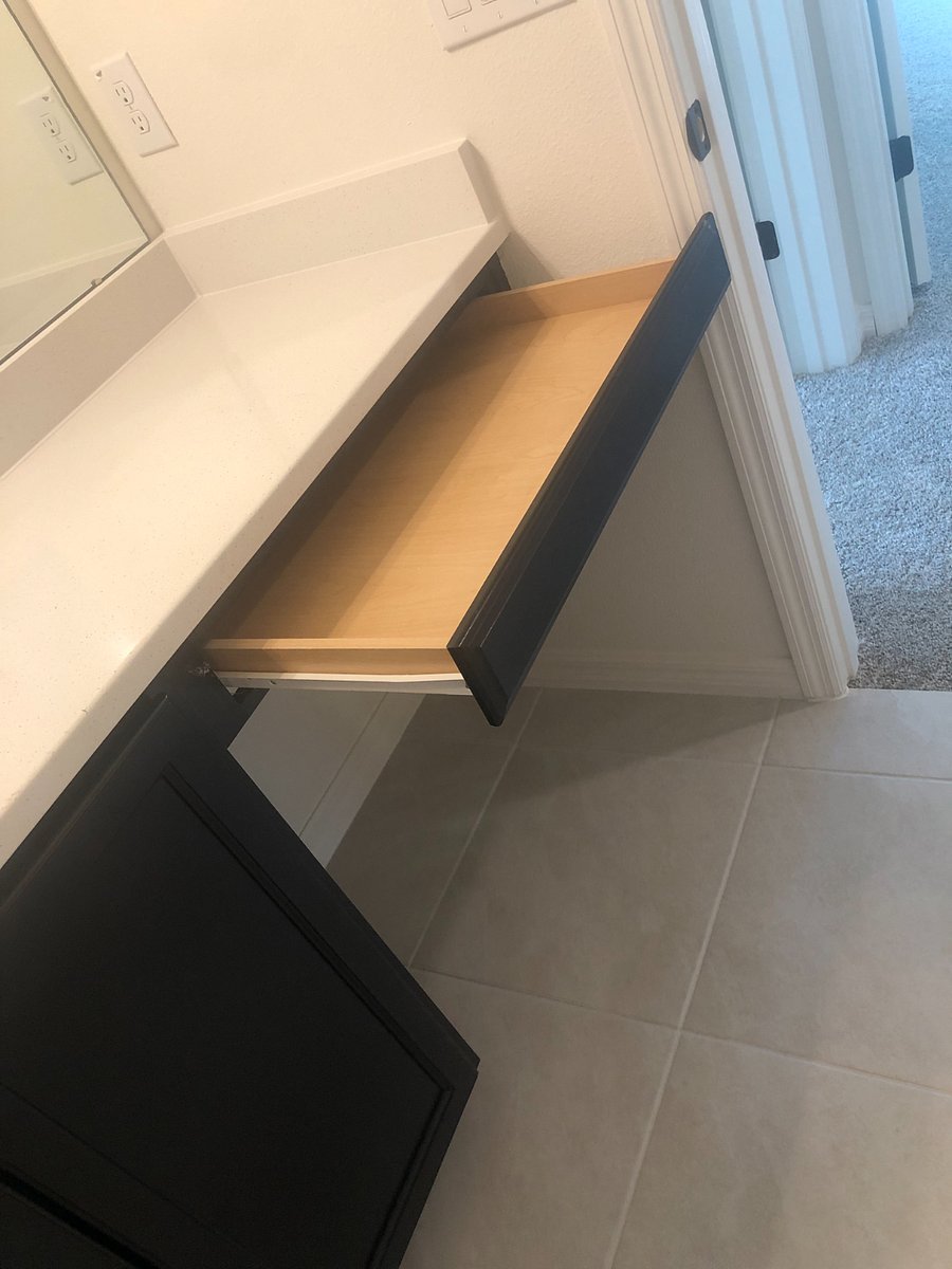 The upstairs bathroom has a large counter and a drawer perfect for storing essentials.