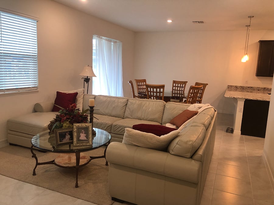 The house has an open floor plan with the living room, dining room, and kitchen all connected.
