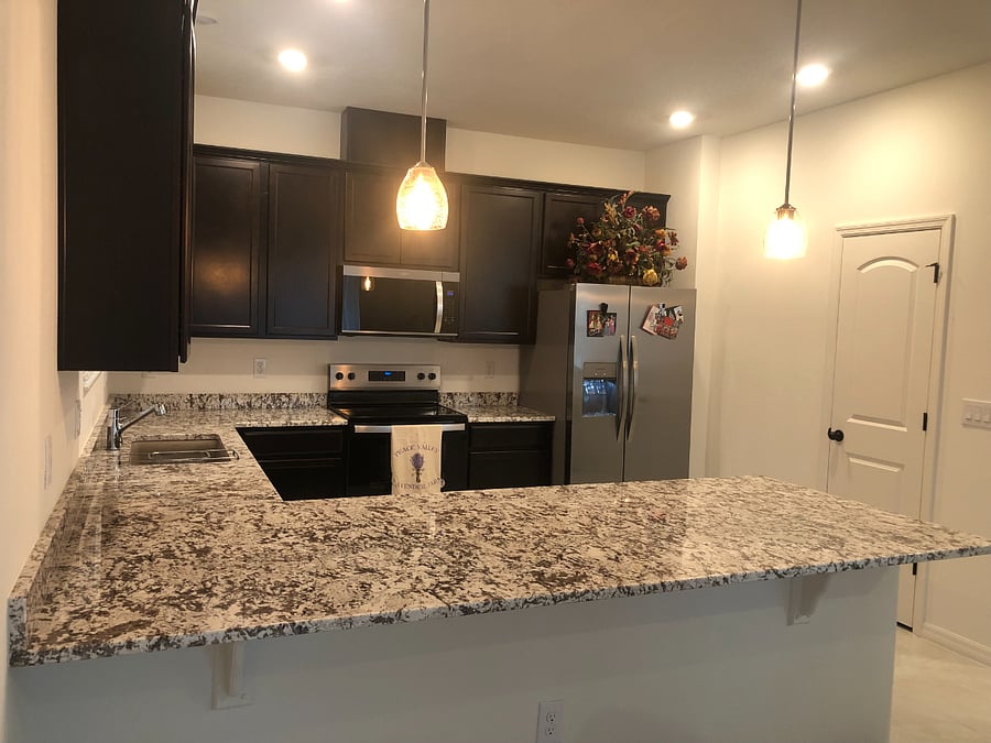 This is the kitchen. The walk-in pantry has plenty of shelf space.