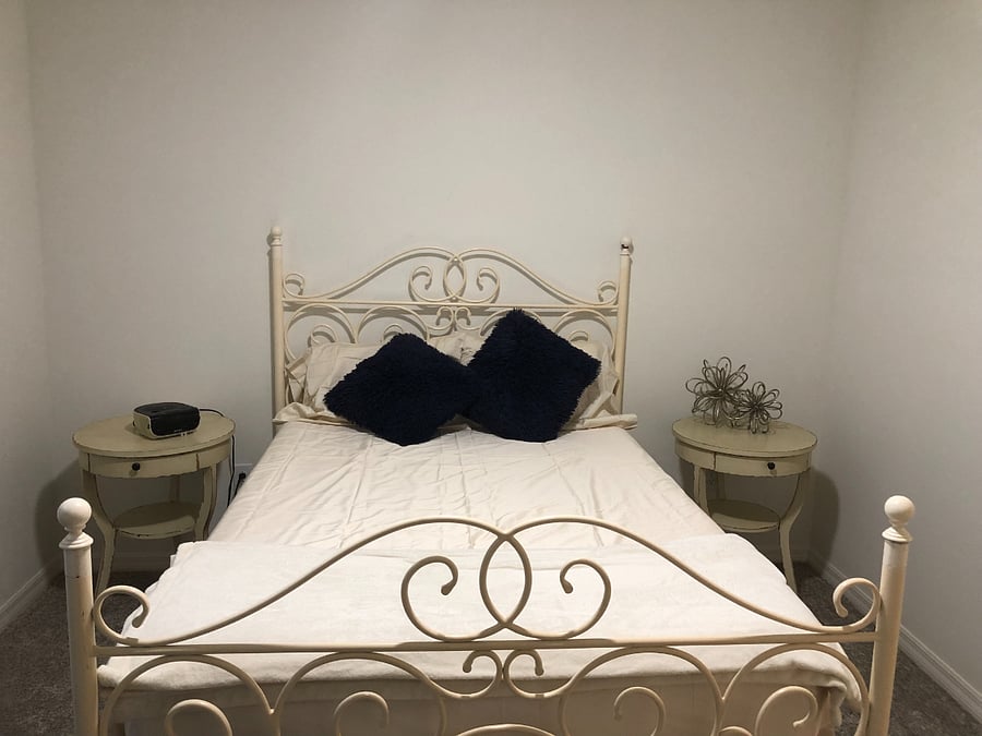 This is the downstairs bedroom. It has a double bed with a pillowtop mattress, 2 nightstands, a dresser and a TV with Roku.