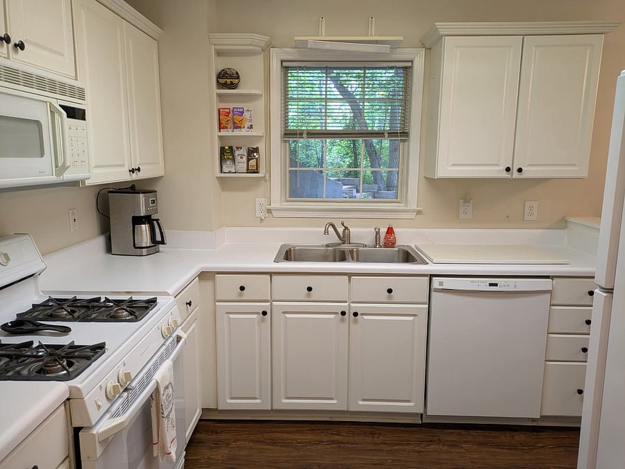 Fully equipped kitchen including dish washer and all cooking and dining essentials.