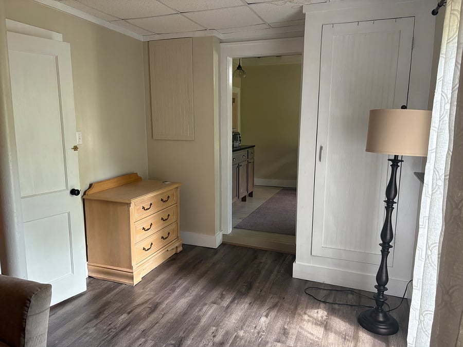 Dresser and closet. Door with lock opens to main basement of house. Homeowners cannot open from that door.