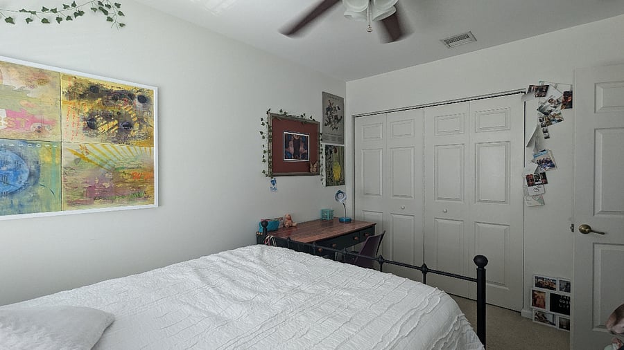 Queen BR with Califormia closet and work desk.