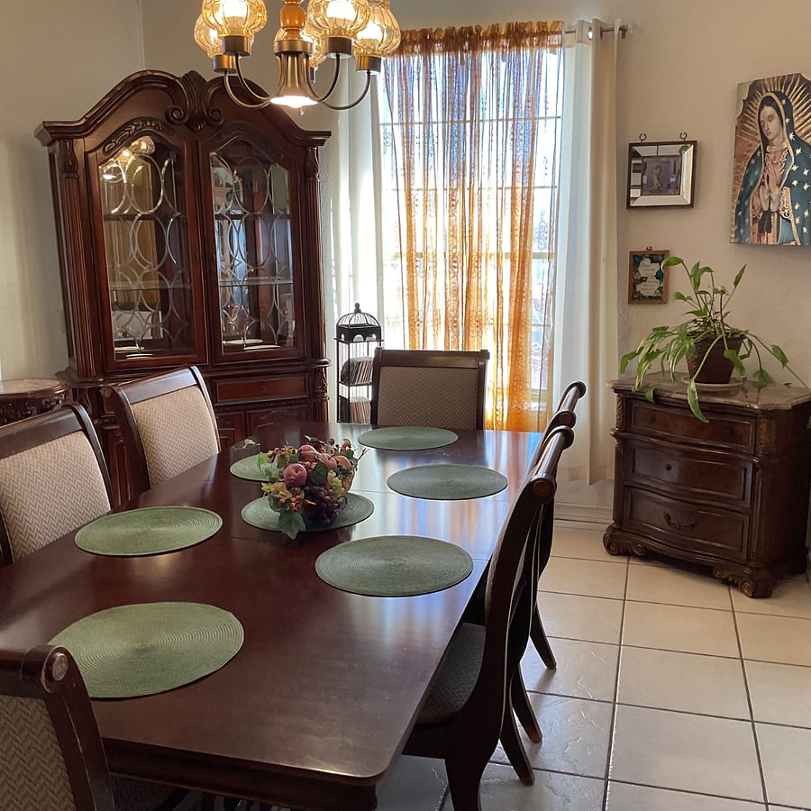 Sunny dining room located off kitchen and to the left of the front door entrance