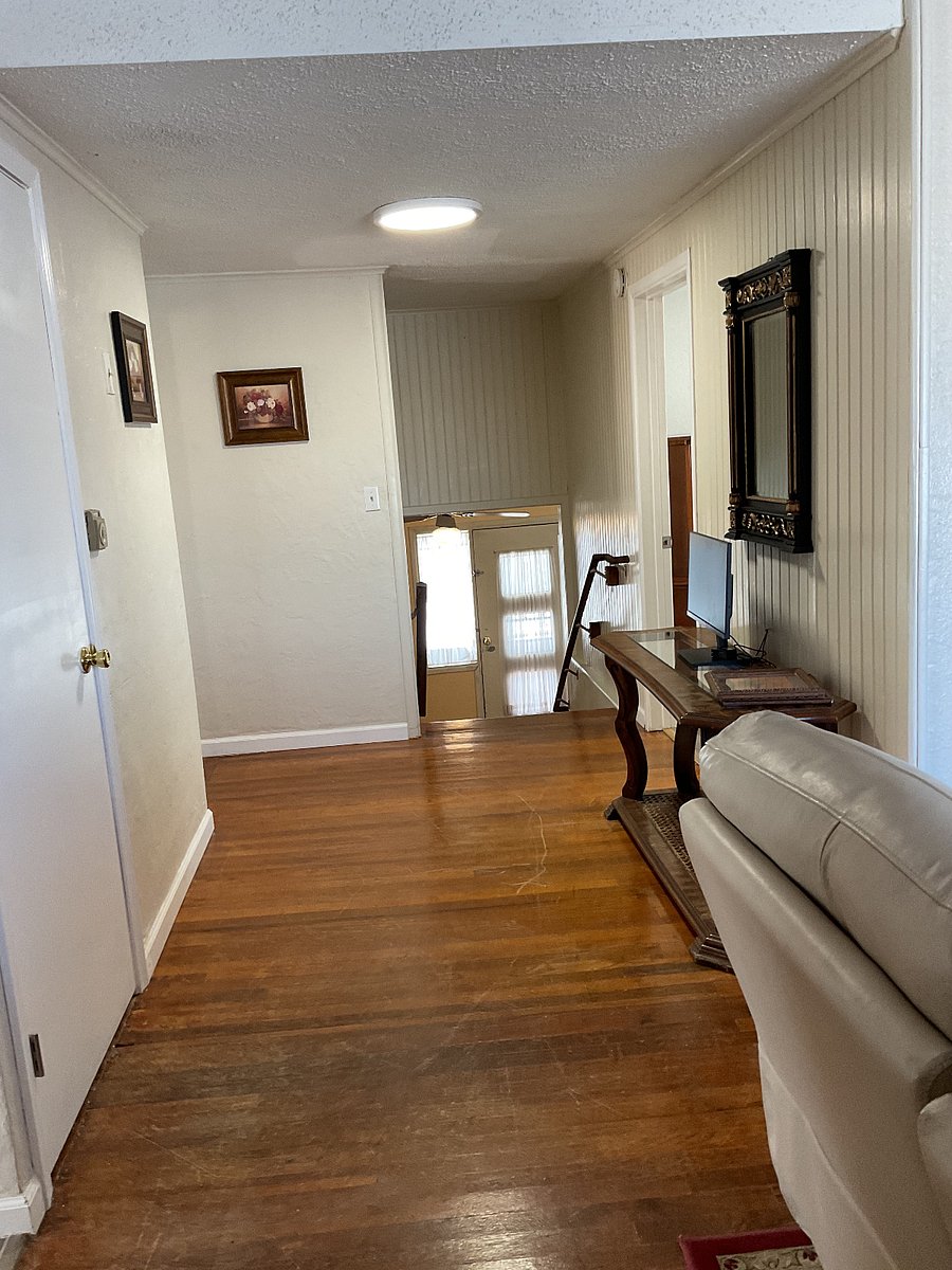 Stairs leading to upper 3rd level of house.
