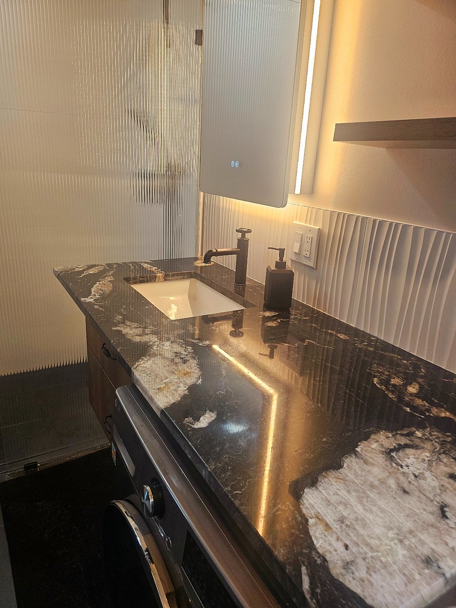 Premium bathroom fixtures paired with a stylish quartz countertop.