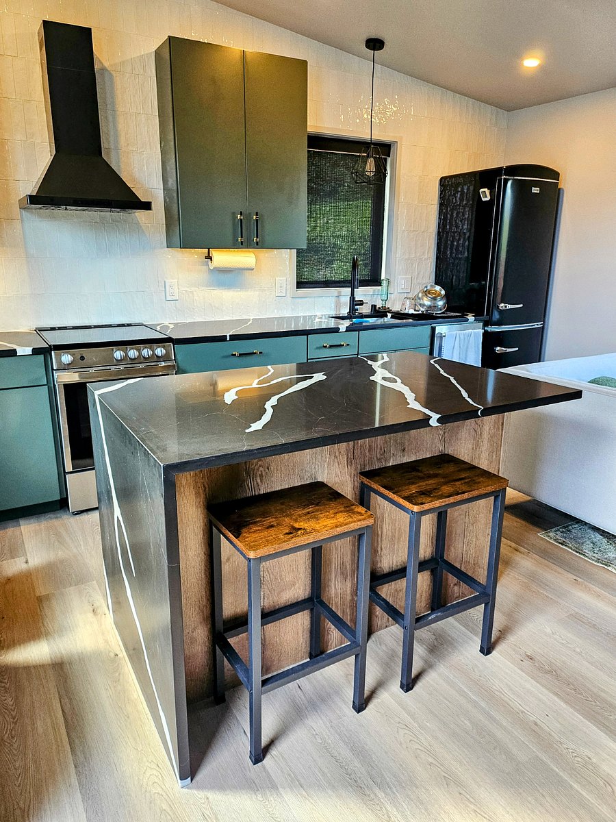 Fully furnished kitchen with elegant quartz countertops and designer finishes.