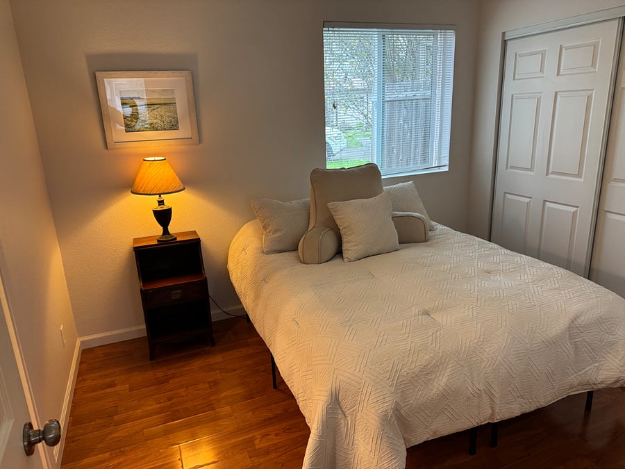The seperate bedroom has a very nice quality bed and bedding.