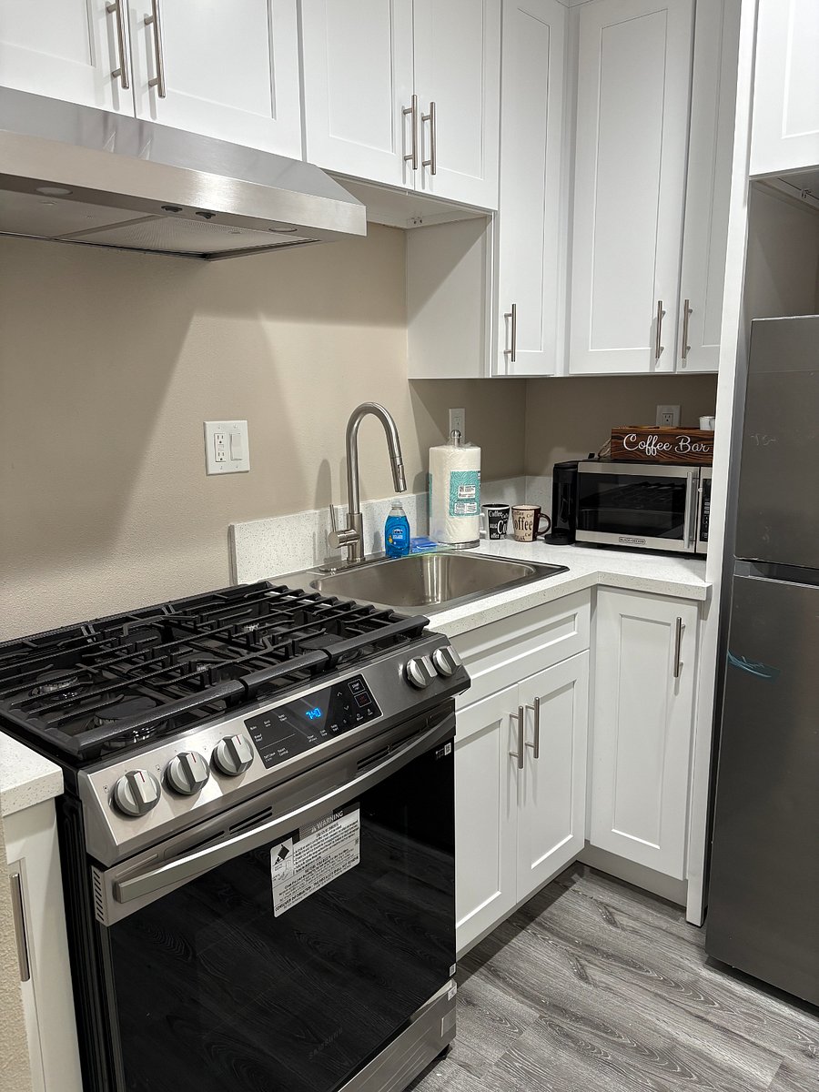 Stove with oven and includes microware, coffee maker, and full size refrigerator