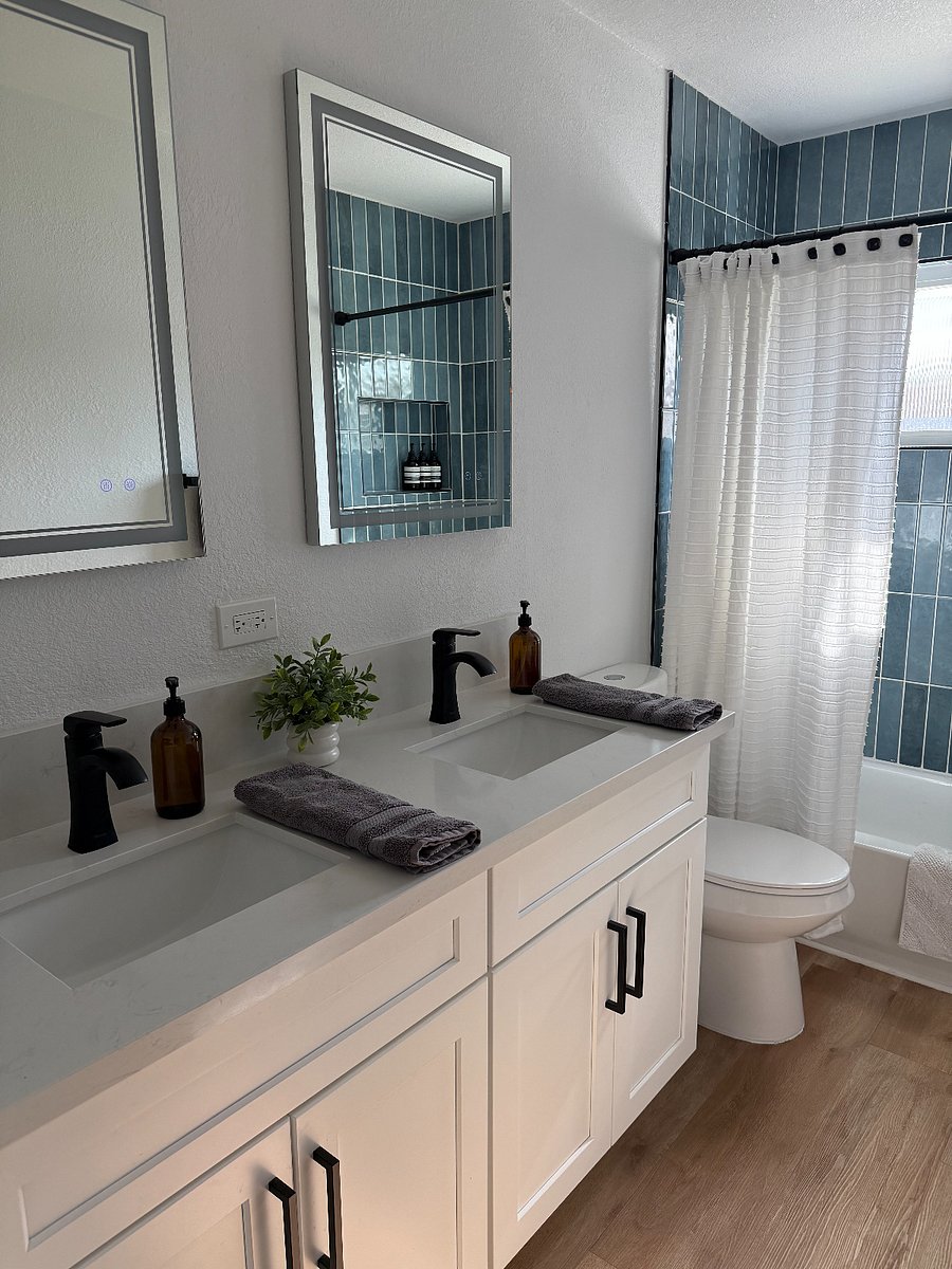Second bathroom, detached from the room, great for guests. Waterfall shower head, shampoo and conditioner provided to start. Duel sink and light up vanity mirrors with warm and cool lighting.