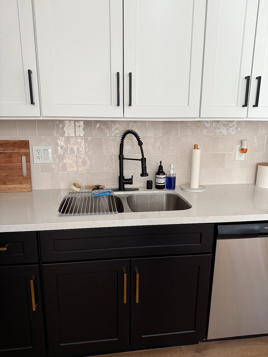 Dish soap and hand soap provided, as well as cleaning supplies under the sink, 2 roles of paper towels, extra sponges, and trash bags.