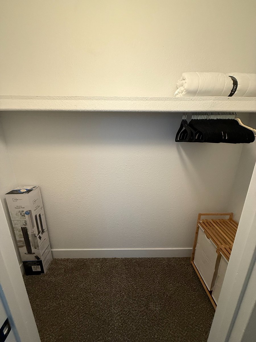 Master bedroom closet, 50 hangers shown in the image. Portable fan + laundry basket.