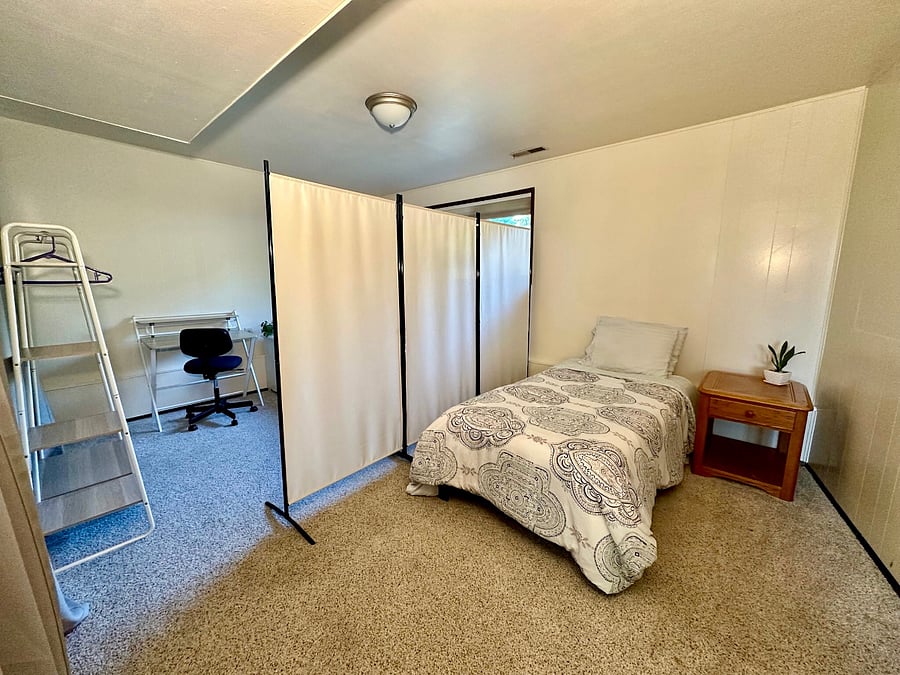 Twin bed #1 next to large walk-in closet (note: furniture can be rearranged if desired)