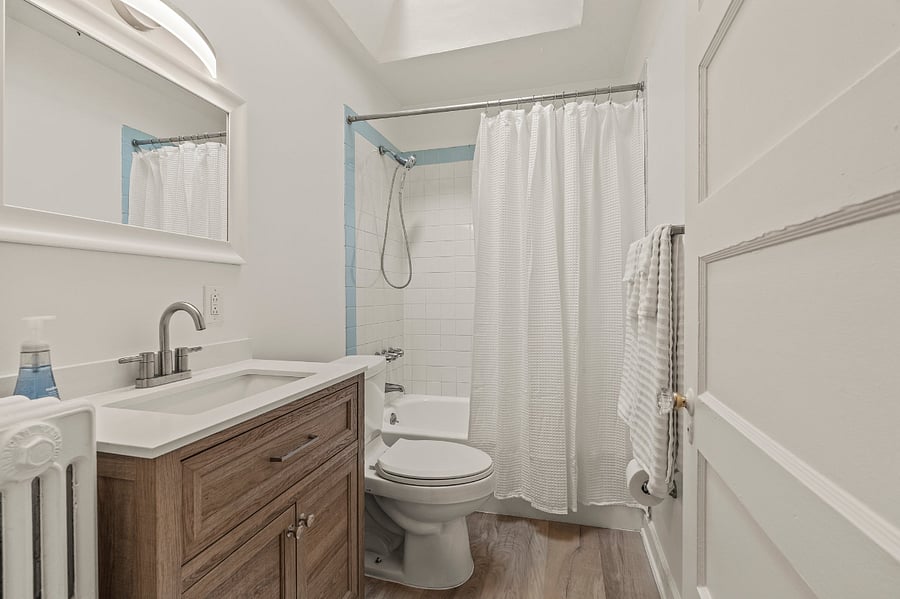 Hall bathroom with shower/tub. New floor and vanity