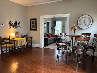 Sitting room is between living room and kitchen.