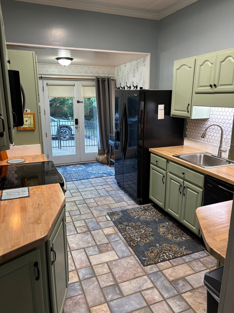 Newly remodeled kitchen leads out to private patio and fenced in backyard.