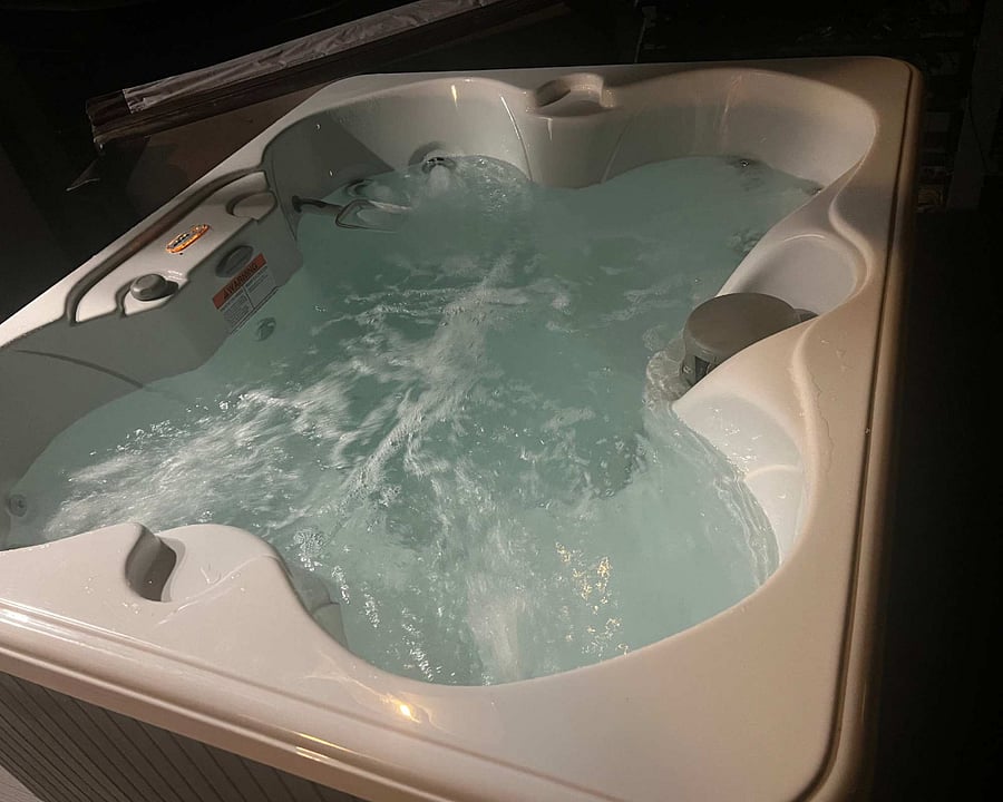 The hot tub for the house is located on the second deck (one of three).