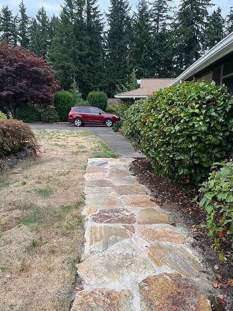 You can park in the driveway where the red car is or on the street.