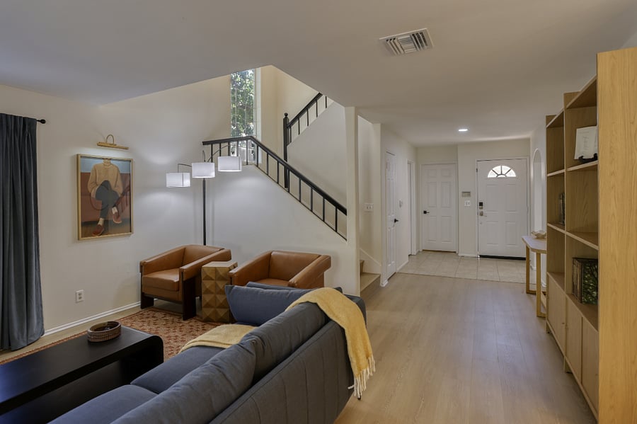 Spacious and inviting from the moment you arrive! This open-concept living area greets you with comfort and style, leading seamlessly from the welcoming entryway to a cozy lounge space. Perfect for relaxing after a long day or enjoying your extended stay.