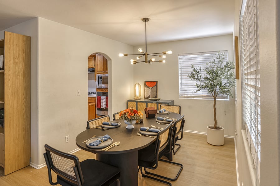 Dedicated dining for six, beautifully set for your stay. This elegant dining area features a modern chandelier, stylish seating, and is perfectly positioned for entertaining or daily meals. Enjoy a true 'home away from home' experience.