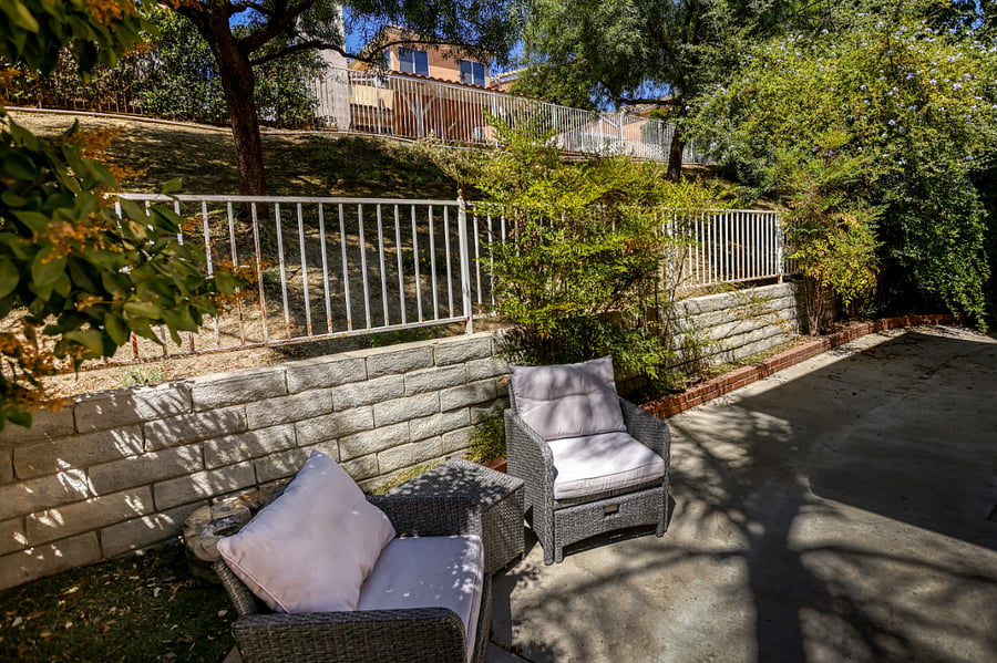 Escape to this quiet, terraced backyard, designed for ultimate relaxation and fresh air. Whether you're sipping your morning coffee or curling up with a book in the afternoon sun, this secluded patio offers a peaceful retreat from the hustle and bustle.