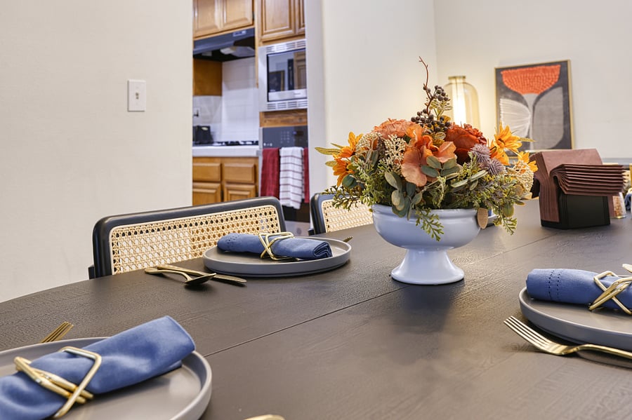 Gather for a memorable meal at this expertly styled dining table, where modern sophistication meets warm, homey charm. Located just steps from the kitchen, this space is designed for hosting dinner parties or enjoying a quiet, upscale meal at home.