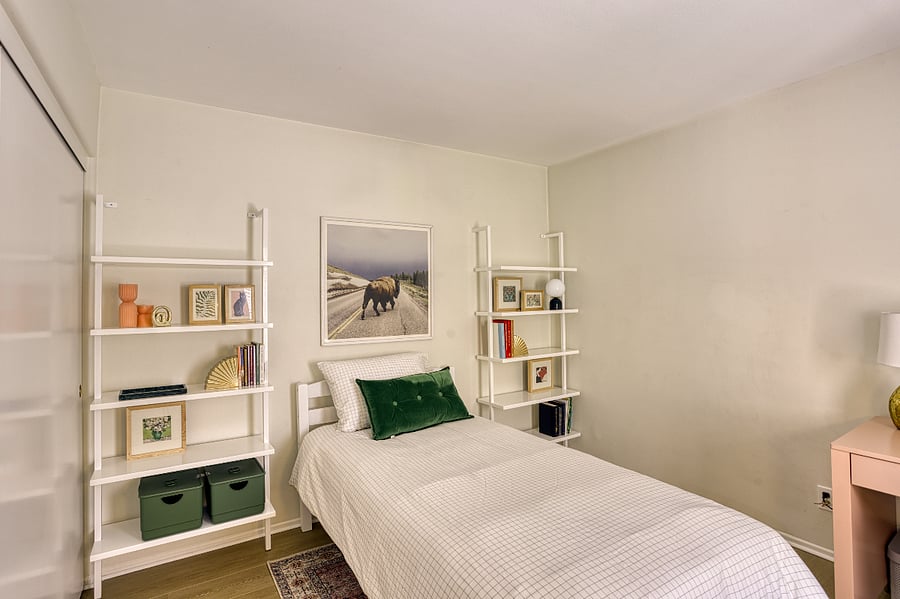 Relax in this thoughtfully designed bedroom, featuring a comfortable twin bed and a clean, modern aesthetic. Perfect for solo travelers or younger guests, this room offers a peaceful atmosphere with plenty of personality.
