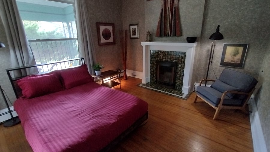 Living/Bedroom
Window behind bed looks out into the front porch and yard.