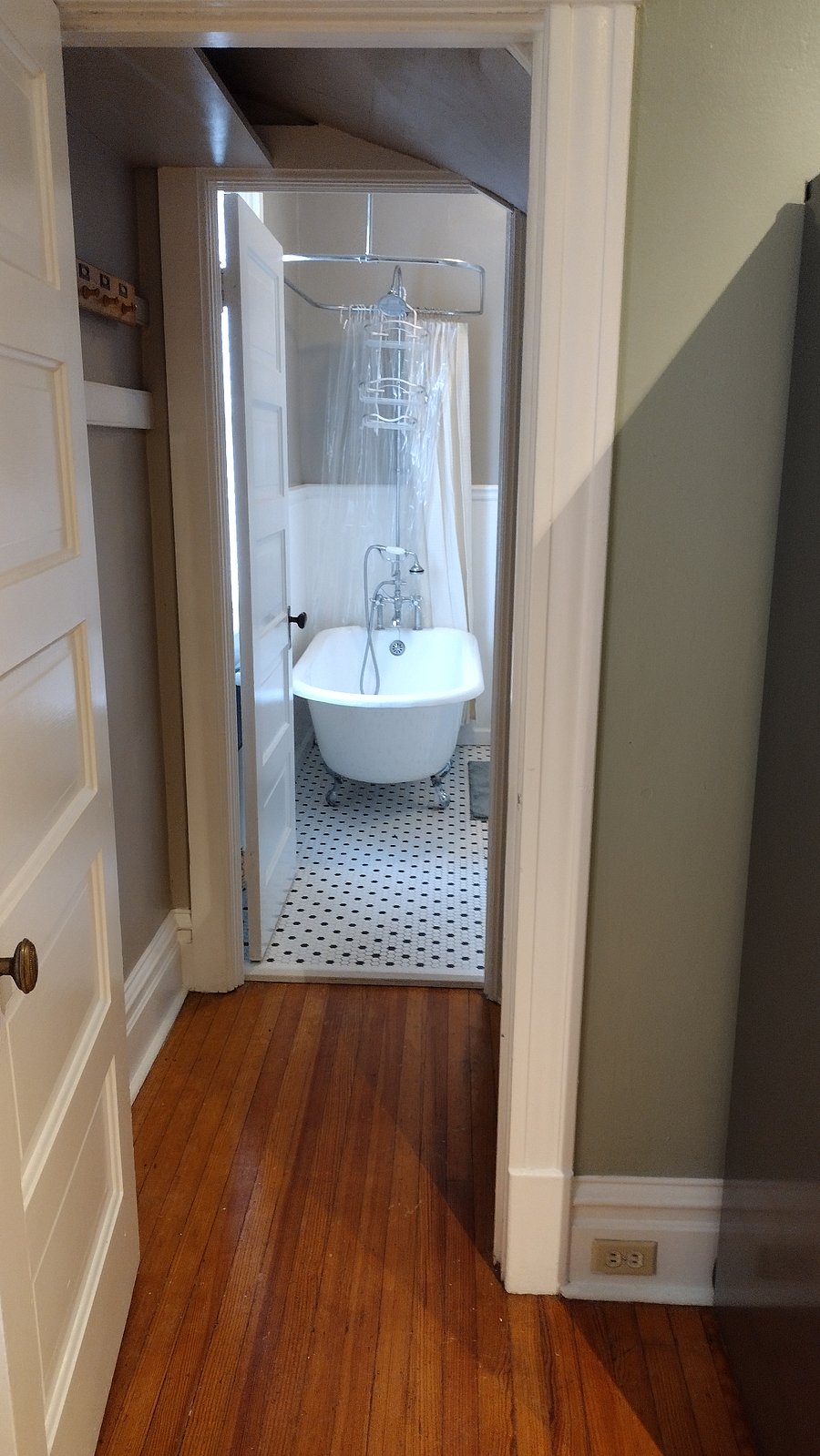 Wow! Look at that cool claw foot tub! It's great for taking a nice long soak in. Prefer a shower, there's a nice big shower head.