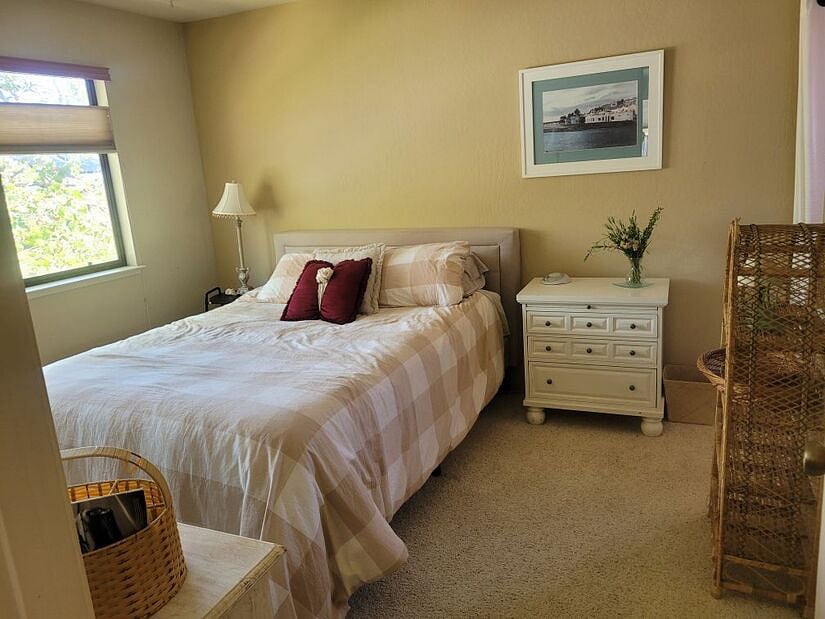 Bedroom #1 with dresser and end table and closet with shelves