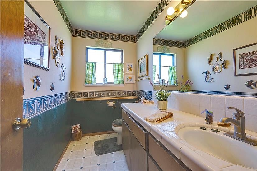 1/2 bathroom downstairs off of the entry way livingroom 