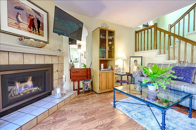 livingroom and fireplace insert 
Stairway to 2nd floor where bedrooms and  loft room are