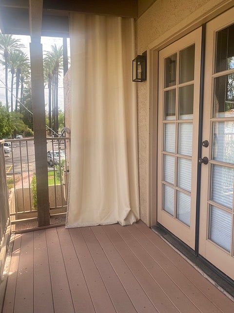 Back patio balcony area with privacy curtain