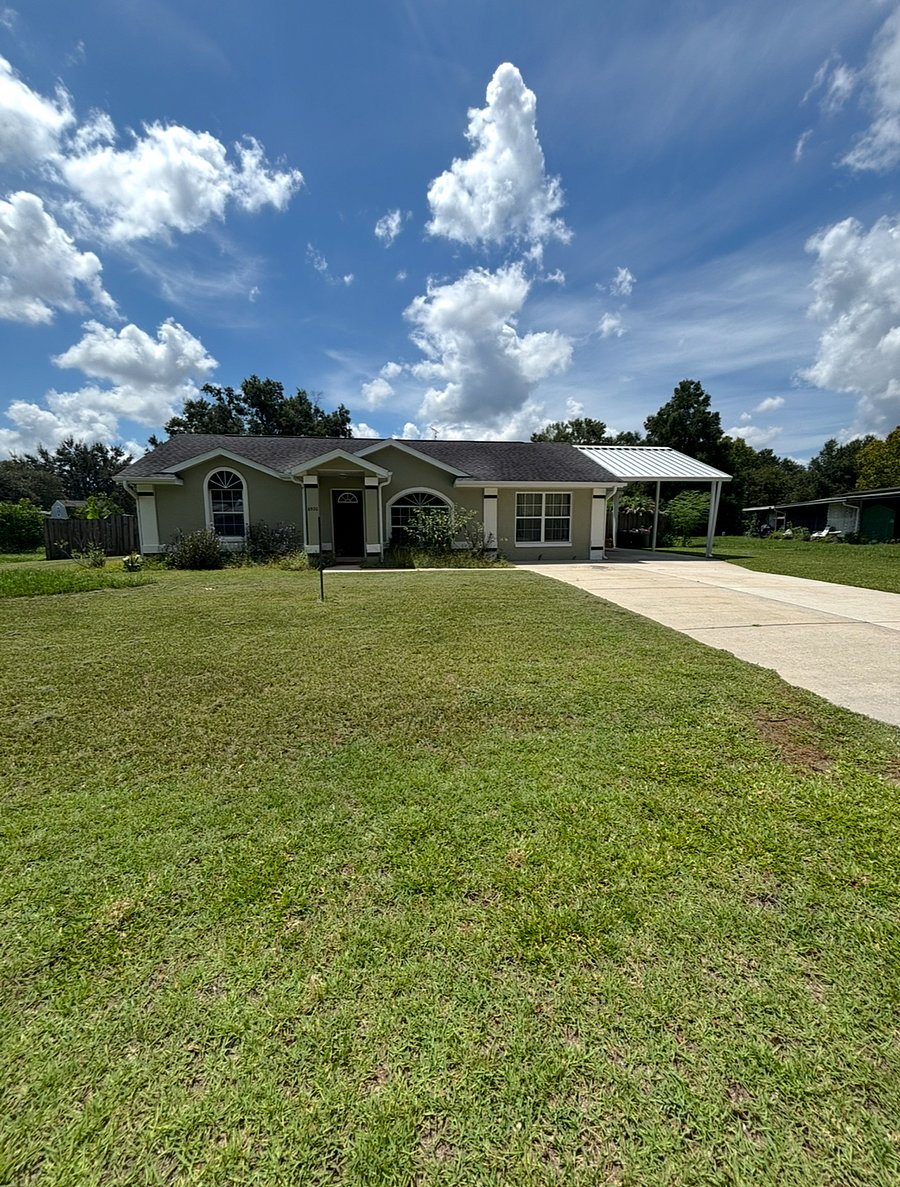 Carport, extended driveway, for 5+ vehicles, and front/side yard grass okay to park trailers, campers, etc. 1 concrete space in back yard (vehicles only)