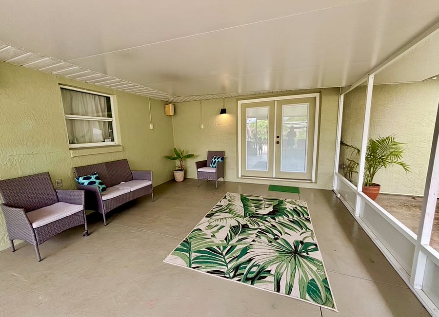 Outdoor Seating
Relax on the screened-in back porch with seating for 4, plus additional seating for 6 more guests outside.